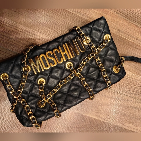 Moschino Handbags - 👑✅PRICE FIRM✅SUPER SALE!! 👑AUTHENTIC Moschino Leather Clutch black goldBag
